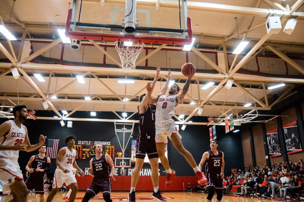 Dashawn McDowell driving hard to the basket for the Redhawks as they take down UPS in their season home opener on Wednesday, November 7.
