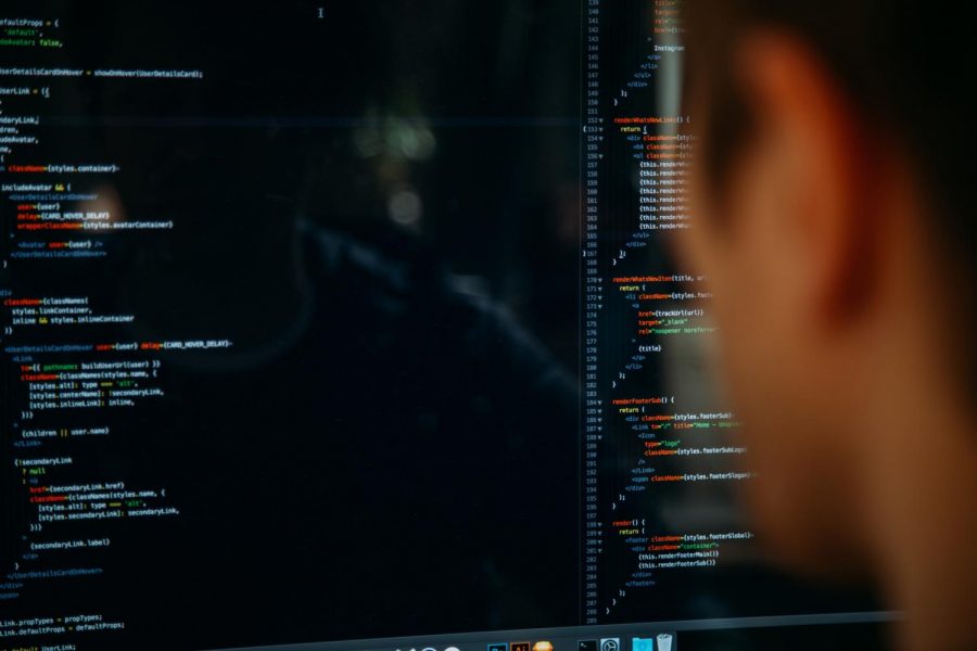a person looking at a screen of code