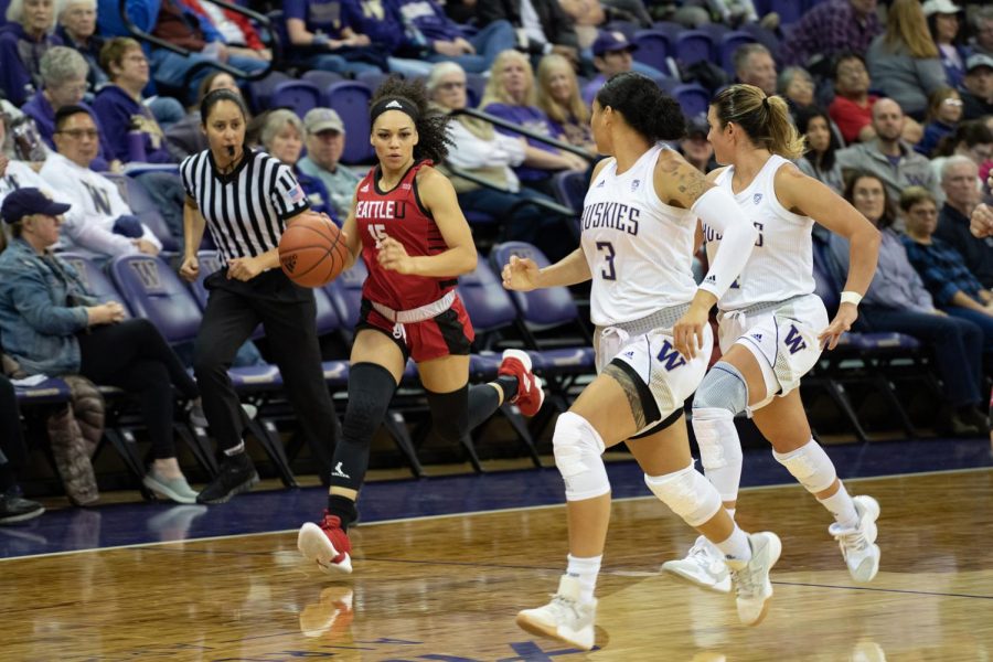 Kamira Sanders runs down the court in the fight against UW on November 23, 2019.
