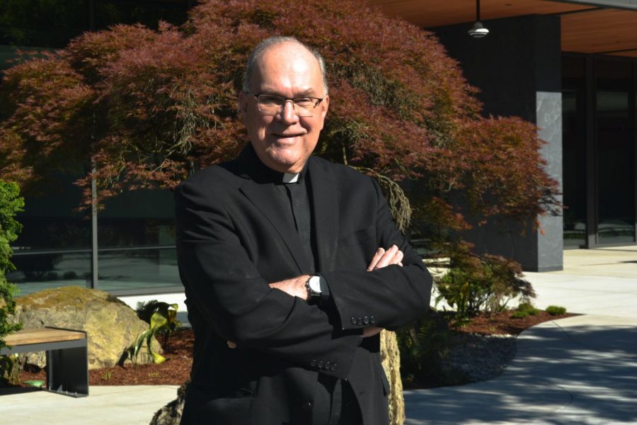 Stephen V. Sundborg, S.J. featured in front of the Center for Science and Innovation. 