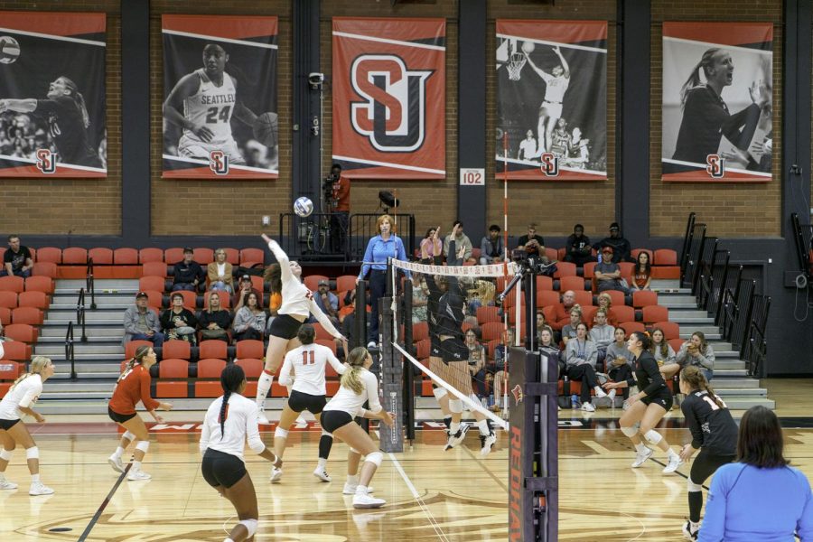 Number 22 Shanice Horn spikes the ball over the net against Sam Houston University.