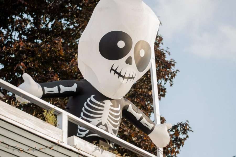Skeleton Halloween decor hanging by a Capitol Hill house.
