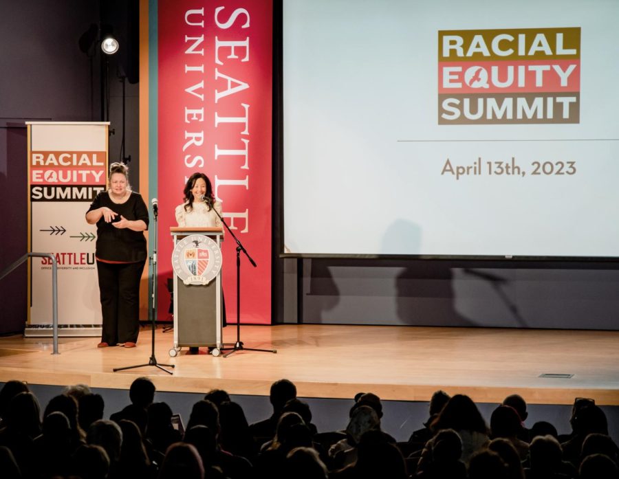 Dr. Sharon Suh, Seattle University professor, leading the audience through a short meditation. 