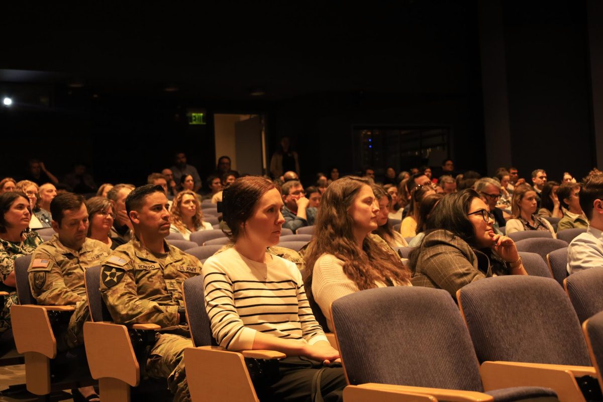 Town Hall attendees listen to President Peñalver present.