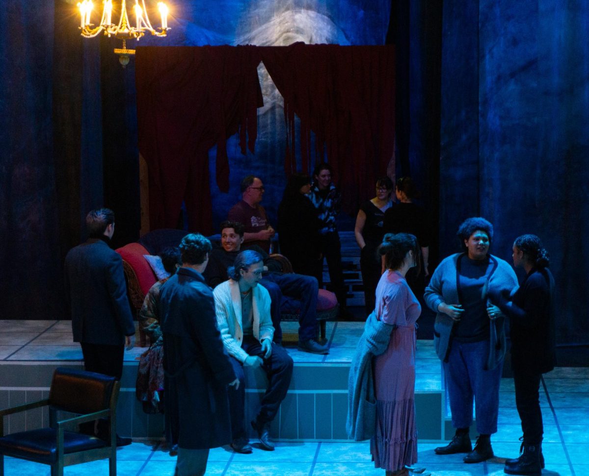 The cast hangs out on set, ready for their performance.